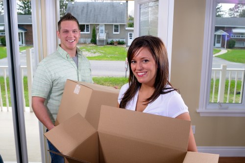 Removal team preparing a home move in Haringey with boxes and furniture