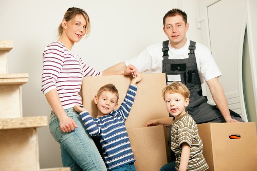 Professional movers loading furniture from a Haringey home
