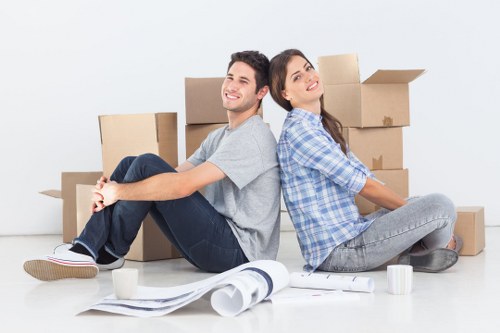 Packed moving boxes and wrapped furniture ready for a house move in Haringey