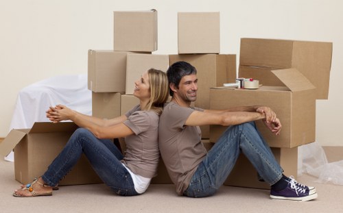 Professional movers loading items carefully for transport in Haringey