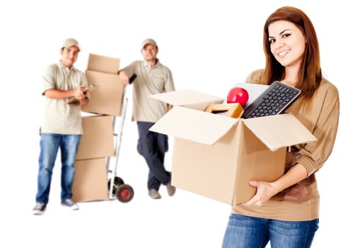 Staff using careful lifting techniques during a move