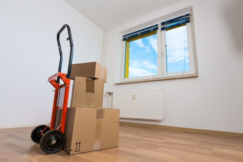 Removal team handling furniture inside a property