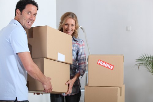 Local moving team handling boxes and furniture in North London