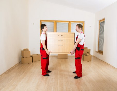 Packed moving boxes and furniture ready for a house removal in Haringey